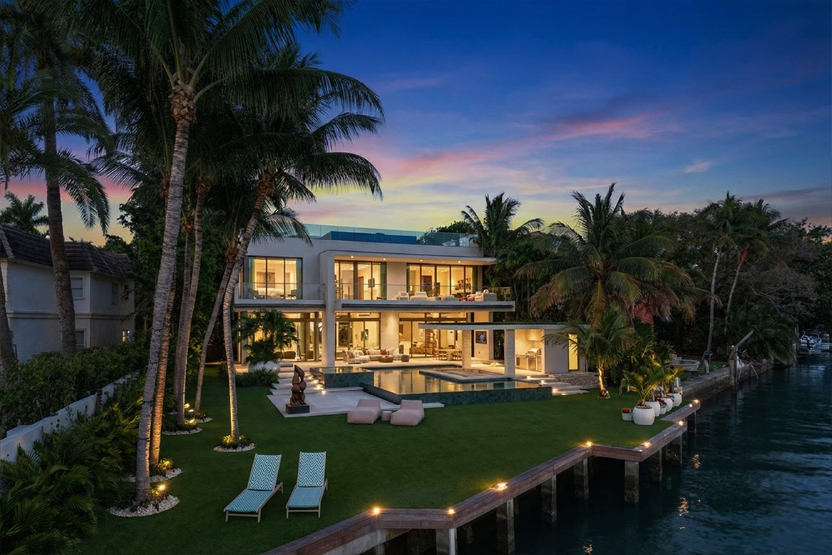 5004 N Bay Road waterfront estate at sunset